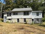 Tucked away on a quiet back road, this two-bedroom fixer-upper offers endless potential on three bucolic acres. Just minutes from the Taconic State Parkway and Lake Taconic State Park, it&rsquo;s the perfect location for a weekend retreat or full-time country living.The home features a partially finished basement and plenty of space to reimagine and renovate to your style. With some vision and updates, this cottage can become your ideal country getaway.Property sold AS IS. Please note that flood factor on Zillow and Realtor.com is incorrect. Property is not in a flood zone.