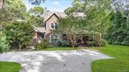Step into this fully renovated 4-bedroom, 4-bathroom home offering over 3, 300A&#177; sq. ft. of living space on 0.52A&#177; acres in the heart of Wainscott. Designed for versatility, the layout includes two primary bedroom suites with walk-in closets-one on the main level and one upstairs-plus additional rooms ideal for a home office, studio, or guest accommodations. An accessory apartment with private entrance adds options for multi-generational living, live-in help, or rental income. Recent upgrades include a new roof, new kitchen with high-end appliances, new bathrooms, new wide-plank hardwood flooring, two laundry areas with new machines, central air conditioning, and a new pool liner. The open-concept living and dining areas flow seamlessly to the backyard through walls of glass, filling the home with natural light. Two wood-burning fireplaces provide cozy gathering spaces. Outdoors, enjoy a heated pool, spa, deck, and established gardens, complemented by a 3-sided wraparound porch perfect for summer relaxation. A full basement with high ceilings offers ample storage or potential for finishing, with room for an additional 1, 300A&#177; sq. ft. of living space. Located minutes from world-class ocean beaches, East Hampton Village, and Sagaponack, this home offers peace, privacy, and convenience. Situated within the sought-after Wainscott School District, 22 West Gate Road is an exceptional Hamptons opportunity ready for immediate enjoyment.