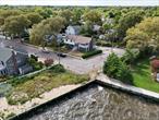 Waterfront - Totally Updated Huge House With Panoramic Views Of Great South Bay. Welcome To 57 Grandview Dr. Truly A Home With Grand View Of the Water!Experience Luxury Living In This Fully Renovated, One-Of-A-Kind Waterfront Home Offering Breathtaking Views Of The Great South Bay From Nearly Every Room. No Expense Was Sparedâ€”Featuring New Siding, Windows, AC, And A Gourmet Chef&rsquo;s Kitchen With Granite Countertops, Top-Tier Appliances, Wine Cooler, And Oversized Island. Elegant Details Include Custom Molding, Modern Lighting, Hardwood Floors, And Spa-Like Bathrooms With LED Mirrors And Full Tiling. Freshly Painted Throughout And Move-In Ready, The Home Also Includes A Newly Finished Patio With Paversâ€”Perfect For Entertaining.Bonus: A Turnkey Mother-Daughter Setup With A Private Entrance, Ideal For Guests, Extended Family, Or Extra Living Space. Enjoy A Private Beach, Front Deck Views Of Fire Island, Walk A Few Steps To The Famous Blue Point Pier. Photos Don&rsquo;t Do Justice Of What Views You Will Own. This House Is Much Bigger Than It Looks. This Is A Must See For Yourself & Compare To What Other Blue Point/Water Front Homes For Sale Offerâ€”This One Wonâ€™t Last! Truly A Rare Waterfront Gem In A Prime & Highly Sought After LOCATION, LOCATION, LOCATION!!!