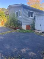There are two other SBL parcels that come with it; 50.-3-20  and 50.-3-21 (75x263) Living space is in excellent condition, sunroof with skylight, large bathroom with Jacuzzi tub. Circular driveway, easy in and out. Very quiet dead end street. Lease may be considered later. Two sheds/storage space.