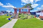 Calling all contractors, investors and flippers!! Don&rsquo;t miss this incredible waterfront opportunity on a huge irregular lot at the end of a canal. 3 bedroom, 1.5 bath ranch, basement, living room with fireplace, dining room, eat-in-kitchen. This charming ranch offers approximately 1, 100 sq. ft. of living space with a full partly finished basement. Features include: hardwood floors throughout, 2 heating zone -gas conversion 2013, roof redone 2018. Outdoor enthusiasts will love the walkout pier, two floating docks, and new bulkhead redone in 2025, perfect for boating and water activities! Additional notes: Garage has been removed. Located in an AE Flood Zone, with an extremely low annual premium of $509.81. 2 deeded lots: Lot 124 - is approximately 24x100 (.0551 acres taxed at $358.99 included in taxes above)With unbeatable waterfront access and endless potential, this is truly the best deal in Oceanside. Bring your vision and make this your next project!