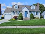 Manicured cape w curb appeal, bright entry foyer w skylight & closet, 4 bdrms, w 1st flr primary, 2 full updated baths 2014, updated eat-in kitchen w slider to yard, living rm, attached 1 car garage w loft storage & back door to yard, full fin bsmnt w laundry/utility rm, office, guest & entertainment space. Hrdwd under carpets & stairs, high hats & crown throughout, private level fenced yard. Roof 2023 , vinyl siding, windows & doors 2003. Close to main rds, parkways, schools, colleges, shopping, hospital, Eisenhower Park. Perfect for legal accessory apartment w proper permits, taxes w/Basic Star Exemption $9538.27.