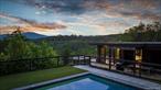 *OPEN HOUSE INVITATIONS*Join us for two special opportunities to experience this extraordinary Hudson Valley retreat:Sunset Open House: Thursday, September 18, 2025 &#183; 4:30 - 6:30 PMDaytime Open House: Friday, September 19, 2025 &#183; 1:00 - 3:00 PMCome preview this one-of-a-kind property, take in the sweeping Catskill Mountain views, and imagine the lifestyle that awaits.__________________________________________________________________________________Every so often, a property comes along that captures both the imagination and the heartâ€”this is one of those rare finds.Designed to immerse you in the beauty of the Hudson Valley, this modern residence sits on nearly nine acres of private woodland and showcases sweeping Catskill Mountain views through walls of glass and expansive decks. Every space has been carefully crafted to create not just a home, but a sanctuaryâ€”where relaxation, recreation, work, and connection all coexist.The main level is the heart of the home: an open-concept kitchen with a central island flows into the dining area and living space, where a Danish woodburning fireplace adds warmth and comfort. Floor-to-ceiling windows blur the line between indoors and out, framing breathtaking sunsets year-round. A spacious ensuite bedroom with a walk-in closet anchors this level, leading to a spa-inspired primary bathroom that impresses with emerald green ceramic tile, dual sinks, and dual showerheads. A private office on this floor provides the ideal space for the working professional, complete with inspiring views.The ground floor expands the possibilities with two additional bedroomsâ€”one with its own ensuiteâ€”and all with sliding glass doors opening to an expansive lower deck with mountain views. Each bedroom includes a dedicated workstation, complementing the private office and making this home exceptionally well-suited for remote work. This level also features a versatile wellness and fitness area, offering ample space for exercise, yoga, or other recreational uses. A generous lounge rounds out the space, designed for gathering, entertaining, or simply unwinding against the backdrop of nature.Everyday living here feels extraordinary thanks to thoughtful details: whole-home smart controls for climate, electric blinds, a built-in Sonos sound system, security cameras, and an EV charger in the covered carport.Outdoors, the home transforms into a retreat for every season. A heated pool invites summer afternoons, while a hot tub, fire pit, and multiple dining and seating areas set the stage for gatherings under the stars. From morning coffee on a quiet deck to evening sunsets over the Catskills, every corner offers a place to pause and take in the setting.Currently managed by Wander.com (property aka: &rsquo;&rsquo;Wander Hudson Valley&rsquo;&rsquo;), a prestigious national vacation rental company, the property also presents a rare opportunity: continue its successful short-term rental program for turnkey income, or simply enjoy it as your own private escape. Just two hours from New York City and close to Stone Ridge, Kingston, Woodstock, and Rhinebeck, this one-of-a-kind home places you at the crossroads of natural beauty and cultural vibrancy.This is more than a houseâ€”it&rsquo;s a complete lifestyle, thoughtfully designed for comfort, flexibility, and the unparalleled magic of the Hudson Valley. Quite simply, this is a home unlike any other.