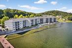 OUTSTANDING water views of Lake Mahopac with Private Balcony in White Sail Condominiums. POOL and brand-new (in-process of being rebuilt) BOAT DOCK. One Bedroom with a DEN and 1.5 baths (extra 1/2 bath is unique to this unit). Modern kitchen with Quartz countertops, Stainless Steel appliances. Washer and Dryer in the unit. Ample closet space. Assigned parking spot in an ideal location in the complex. Second floor unit, close to elevator. Guest parking spots. Fitness Room with new equipment and Clubhouse. Elevator. Boat slips for motorized boats. Walk to local eateries, shops, library and beautiful bike path. Lake Mahopac is known for boating activities (motorized and kayak) and great eateries on the water. A special assessment of $20, 000 for the boat dock and new roof was paid in full and upfront by the current owner! Taxes do not reflect the STAR deduction.