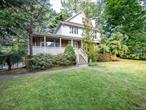 Spacious Colonial boasting 4 bedrooms, 3 full baths, and 2 half baths. The home features a formal living room with a fireplace, a sky-lit formal dining room, a large den with a fireplace, and a granite eat-in kitchen with stainless steel appliances that opens to the deck. A vaulted second-floor landing with skylights flows to a primary bedroom with a fireplace, an en suite bath, two additional bedrooms, and a hallway bath. The lower level has a private entrance to a finished playroom, providing additional living space. The property offers a welcoming front porch, circular driveway, one-car attached garage with additional carport, Anderson windows, gas heat, skylights, in-ground sprinklers, and central air. EM Baker Elementary, Great North Middle and High School.Residents enjoy the Great Neck Park District amenities, including Olympic pool, ice skating, sailing, parks, concerts, and Steppingstone waterfront park. MUST SEE!!