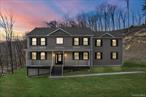 Welcome to a stunning brand new Colonial Home nestled in the heart of the town of Wallkill . The grand front entrance boasts with a two-story foyer with iron stair balusters and a gorgeous combination of iron and wood. The main floor with its gleaming hardwood floors offers a spacious living room with built-in electric fireplace to a family room to a dining dining area open to a beautiful kitchen with a massive gorgeous island, beautiful quartz countertops, backsplash tiles, a farmhouse sink plus stainless steel appliances and elegant light fixtures. This main floor is perfect for entertaining with windows flood the home with natural light. The second floor offers hardwood floors in the hallways and in all the 4 bedrooms. A primary suite master bedroom with its huge walk-in & a built-in closet plus with a luxurious master bathroom. Additional a great size full bathroom and a spacious laundry room are on the 2nd floor. The basement is fully finished with a full bathroom holds a spacious living space with tiles floorings. It is perfect for any type of entertainment: a movie room, a home gym and a play room. Conveniently located less than 60 miles from NYC, minutes to shopping, Buses and Trains stations and major highways. Please note the pictures of yard are with artificial grass images.