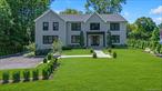 Bright, open, and expertly built with the highest quality features and finishes by a distinguished Hamptons developer, this nearly 7000sf home, fully completed in 2025, over delivers in every way. The floor plan is intuitive. The living space is unified by the consistent use of 8â€ white oak flooring, glass panel railings along the 3-level staircase, high ceilings and oversized windows.The complement of rooms on the first floor offers optionality: a large room off the front door is equally suited to a home office, den or bar and sits across the double-height foyer from the dining room. The impeccably outfitted chefâ€™s kitchen backs a generous walk-in prep kitchen/pantry and the breakfast area opens to a handsome mahogany outdoor deck. The adjoining living room/great room features a full-height (gas) fireplace wall, and another spacious room makes a perfect playroom or game room. The home features 6 oversized en-suite bedrooms and 6.5 baths, with 4 (including the primary) on the second floor, one on the first floor and the last in the lower level which also includes a gym, wine closet, large recreation space, mudroom, outdoor access and access to the two-car garage with EV-charger. and true egress via covered bluestone patio. For ultimate convenience, there is a second floor laundry room with two sets of washers and dryers. Prime Flower Hill location. Exquisitely landscaped .4-acre property. This exceptional offering could not be duplicated for its asking price if built today.