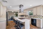 Welcome to this beautifully maintained home in a highly sought-after Newburgh neighborhood. With exceptional curb appeal, a newer roof (2019), and a peaceful, manicured yard, this property perfectly blends charm, comfort, and thoughtful updates.Inside, youâ€™ll find an updated kitchen (2020) designed for both cooking and entertaining, a cozy fireplace that anchors the welcoming living area, and a flowing floor plan ideal for everyday living. Upstairs, spacious bedrooms and ample storage provide convenience and comfort. Modern upgrades like a 2024 water heater and an owned solar panel system (with 20 years remaining on payments) ensure energy efficiency and peace of mind. The sun-filled sunroom, showcasing brand-new flooring, adds warmth and elegance to the homeâ€™s inviting atmosphere.Step outside to your private backyard retreat featuring a flat, lush lawn and a tranquil water featureâ€”perfect for relaxing or hosting guests. The two-car garage adds year-round practicality, making daily life even easier.Beyond the property, youâ€™ll love the nearby wineries offering tastings, farm-fresh food, and scenic views, as well as orchards where you can enjoy apple picking, seasonal activities, and family-friendly funâ€”all part of the best Hudson Valley living.Donâ€™t miss your chanceâ€”schedule your showing at 36 Lexington Dr today!
