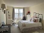 This South facing, quiet and sun-filled co-op offers a generously sized bedroom and living room, complete with a bonus alcove perfect for a home office. Features include gleaming hardwood floors throughout, stainless steel appliances with dishwasher, and a brand-new AC unit. The well-maintained building provides convenient amenities such as a laundry room, elevator, secure key fob entry, and a live-in super. Located just 2 blocks from the LIRR Port Washington lineâ€”a quick 28 minutes to Manhattanâ€”youâ€™ll also be moments away from shops, restaurants, fitness centers, pharmacies, and more. Maintenance includes taxes, heat, water, and trash removal. Service pets only. Move-in ready and perfectly located, this is an ideal place to call home!