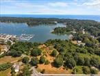 A uniquely expansive 7.12 acre waterfront property, partially wooded, on West Harbor. &#160;This exceptional property offers natural beauty and possible multiple building sites, each with shoreline access and views over the yacht club anchorage, as well as convenient access to the nearby amenities and services on the islandâ€™s west end.