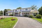Beautifully Expanded Colonial Splanch Home w/2 Primary Suites. Main Floor plus Upstairs Primary Suites. Perfect for Parents/Inlaws w/Handicap Accessible Bath! Home Offers an Open Feel. ATTENTION CAR/TRUCK LOVERS.... 2 Story 2 Car Attached Garage w/ 2 Lifts, Accommodates Garage Parking for 4 Cars. Unfinished Basement under Garage w/10&rsquo; Ceilings & Steel Beams. An Additional Partial Finished Basement under Living Room. Circular Driveway! Whole House Wrap Around Porch. New Leaded Glass Front Door. Remodeled Eat In Kitchen w/Cherry Cabinetry & Quartz Counters. All Updated Baths. Family Room w/Stone Wall Fireplace, Vaulted Ceiling & Atrium Sliding Doors. Living Room Vaulted Ceiling. Hardwood Floors Throughout. Andersen Windows & Doors Throughout. Recessed Lighting. Whole House Generac Generator w/New Natural Gas Line. 3 Zone Heating. Central Air &rsquo;21, Roof & Gutters &rsquo;22, & Gas Hot Water Heater &rsquo;23.  In Ground Sprinklers. Outdoor Lighting. Fire & Burglar Alarm System. Private Landscaped .30 Acre Setting. Close to Schools, Shopping, Highways & The Cold Spring Harbor Train Station