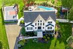 MUST-SEE GRAND COLONIAL! Perfectly situated on a stunning property, this exceptional residence showcases a sparkling gunite pool and a private sports courtâ€”your own resort at home. WOW, welcome to perfection! The main floor is designed for both comfort and entertaining, featuring a state-of-the-art eat-in kitchen with rich cherry wood cabinetry, granite countertops, and high-end stainless steel appliances. The inviting family room with fireplace, elegant formal living room, and gracious dining room provide seamless spaces for gatherings. Just off the kitchen, a spectacular three-seasons room offers panoramic views of the breathtaking grounds. Upstairs, four spacious bedrooms await, including a primary suite with a full bathroom and walk-in closet. Updates include: roof (2019), windows (2019), pool heater and filter (2019â€“2020), boiler (2020), new carpet upstairs (2020), primary bathroom (2020), and AC (2025). All of this rests on a magnificent property that truly has no duplicateâ€”a one-in-a-million opportunity. Come, fall in love, and youâ€™ll never want to leave.