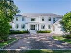 French Modern residence, built in 2018, seamlessly blends contemporary luxury with timeless design. Perched on a prime setting and offering over 7, 000 square feet of refined living, the home presents a stately facade with a columned portico, dramatic windows, and iron-framed glass doors that open to a museum-inspired foyer with marble floors and art niches. The main level is designed with comfort, elegance, and entertaining, featuring spacious living and dining rooms, a bright private study, powder room, library with custom built-ins, and a guest suite with en-suite bath. The inviting family room extends through French doors to the terrace and heated pool, creating seamless indoor-outdoor living. Additional highlights include an extra half bath, back staircases, and an attached garage. High, uniquely styled tray ceilings, intricate moldings, and pocket doors enhance the homeâ€™s flow and architectural character.The chefâ€™s kitchen is a true centerpiece, boasting marble counters, three Sub-Zeros, five ovens, an eight-burner stove, three Miele dishwashers, and a sunlit breakfast room overlooking the lush yard.A striking custom staircase with bold geometric iron balustrades leads to the second level, which offers five bright ensuite bedrooms, each with distinctive tray ceiling designs. The luxurious primary suite features a spa-like bath with artistic mosaic tilework, a magical balcony with seasonal water views, generous custom closets, and the convenience of an upstairs laundry room.The full lower level expands the living space with three additional bedrooms, four full baths, a second kitchen, a den, a playroom, a glass-walled gym, a wine cove, a recreation area, and a secondary laundry with two washers and two dryers. High ceilings and a walk-out design enhance the sense of light and space.Additional features include radiant heat warming all stone floors throughout, a full-house generator, and an elevator shaft already in place for future installation. Outdoors, manicured landscaping and mature hedgerows provide privacy around the expansive bluestone terrace, lush lawn, and heated pool.Located in the prestigious Village of Great Neck Estates MUST SEE! A true standout residence!