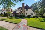 Nestled in the heart of the highly sought-after Crestwood neighborhood, this delightful 1927 Tudor home is a perfect blend of timeless elegance and character. Loved by its original owners of 55 years, and ready for its new chapter. It offers a spacious layout that maintains its classic charm. Original wood floors flow throughout the home, starting with the welcoming foyer that leads to a bright and airy living room featuring a wood-burning stone fireplace. The formal dining room is ideal for entertaining. The kitchen is generously sized, and a convenient powder room completes the first floor. Upstairs leads you to a primary suite and two additional large bedrooms, and a centrally located full bathroom with a tub. The full, partially finished basement offers even more storage potential and room for creative possibilities. The property also includes a two-car garage, with additional parking space in the driveway for several cars. Conveniently located near the parkway, Metro North, shopping, dining, and schools. Perfect for commuters- walking distance to the Crestwood train station, and for the book lovers- you can walk to your own cozy neighborhood library!