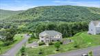 Pomona! A Rare Find in Rockland County!Perfect for extended families, a summer retreat, or anyone who loves to entertain, this young colonial offers incredible space and flexibility. With 8 bedrooms and 5.5 fully tiled bathrooms, thereâ€™s room for everyoneâ€”inside and outâ€”on a scenic property featuring unobstructed mountain views.The main level boasts a grand dining room, chefâ€™s kitchen with 2 sinks, 2 ovens, a double fridge/freezer, stone backsplash, abundant cabinetry, and a butlerâ€™s pantry. The spacious family room features a cozy gas fireplace and opens to a unique bonus â€œround roomâ€â€”an ideal spot for relaxing or entertaining. Also on the main level: 2 bedrooms, 1.5 bathrooms, a library, and plenty of closet space.Upstairs, every bedroom is oversized and can accommodate two double or queen beds, each with organized closets. Enjoy outdoor living on the double-sized deck off the kitchen, a lower-level patio, a basketball court, and moreâ€”all in a welcoming neighborhood. Move right in and enjoy the space, style, and setting you&rsquo;ve been waiting for!