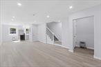 Space, style & modern luxury come together at 110-08 172 Street! A newly renovated brick single family townhouse nestled on a beautiful tree lined street of burgeoning Addisleigh Park/ Saint Albans border. Featuring a wide driveway, indoor garage and is the perfect opportunity for buyers looking for space.Open the door and enter an expansive sun drenched, modern open concept, spacious living/dining area which provides great space for entertaining. Tucked away in the corner the spacious granite kitchen is equipped with floor to ceiling custom cabinetry and adorned with a full fleet of stainless steel appliances. Powder room on first floor for your guest. Up a flight of stairs 3 spacious bedrooms awaits you, each equipped with ample closet space. Down the hall a fully tiled bathroom is adorned with state of the art wall & floor tiles. The high ceiling full finished basement has both interior and exterior access. With its unique setup this space can be used as the perfect in-law unit, media den, guest quarters, or additional recreational space.Renovations include brand new flooring, recessed lighting, updated electrical, heating & plumbing systems throughout. Conveniently located with close proximity to major transportation which makes commuting a breeze. Just off Merrick Blvd, Sayres Avenue, Liberty Avenue. Short blocks to schools, shopping centers, restaurants, cafes, parks and many other vibrant neighborhood amenities.