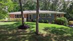 Welcome to 4 Burham Court located on a private Cul-De-Sac in the heart of North Smithtown... This beautifully maintained Ranch features an entry foyer way, formal living room, Formal Dining Room, Den Area with wood burning fireplace, EIK with granite counter tops and an abundance of natural light, 3 bedrooms and 2 full bathrooms, Downstairs you will find an oversized partially finished basement w/ recreation area, ample storage and access to your extremely oversized and spacious 2.5 car garage!!! Step outside to a Very Private & Tranquil fully fenced professionally landscaped property! Additional features include.... Hard wood Floors, Crown molding throughout, Anderson windows, CAC (1 Zone), Oil Heat (2 Zone), 200 AMP electric... All of this and so much more set on a picturesque .65 Acre, you do not want to miss this!!