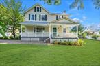 An Oasis in Port Washington.  Escape to this quiet classic front porch Colonial tucked away on a private lane just a short distance to the water, restaurants, farmers&rsquo; market, library and LIRR. Revel in the spectacular sunsets from the open deck, enjoy the oversized side yard under the big oak tree, tend to the beautiful gardens that surround this unique property, or just sit on the breezy front porch and savor the peace and quiet. This completely renovated home includes a formal living room with fireplace, sitting area, dining room, large kitchen with all new appliances, laundry room with new washer/dryer, and new half bath on the first floor, with three bedrooms, two new full bathrooms, a small office, and another sitting area upstairs. A new Amana HVAC system provides whole-house heat and cooling. Both the house and the garage have new roofs. A small, finished basement area and a two-car garage with loft provide plenty of space for storage. There&rsquo;s lots of room for a pool and/or expanding the home.