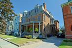Absolutely Stunning brick Second Empire Victorian Mansion w/beautiful Hudson River Views! Located just 60 miles from NYC, this 1884 architectural treasure (on the National Register of Historic Places) is remarkably original, yet has the modern upgrades that make it a pleasure to live in today. Whether you are enjoying the Hudson River views from the west side of the home, enjoying the view of the other historic homes from the east side of the home, or enjoying delicious details, craftsmanship & gracious spaces inside the home, there is ample eye-candy to keep you satisfied. This is a home that really needs to be experienced in person to be fully appreciated. It was designed by Architect Elkanah Shaw (whose family also produced all of the millwork for the home) for one of Newburgh&rsquo;s economic leaders of the day (see the last listing photo) - and as director of the Edison Electric Illuminating Company in Newburgh, Shaw worked with Thomas Edison to electrify the home during its construction (one of the very 1st homes in the world to be built with electrification). The quality of construction is strikingly evident throughout: detailed plaster work, high quality & highly-detailed millwork, basement brick walls supporting all interior walls above them, 5 interior staircases, 7 fireplaces, gorgeous front & rear porches, etc. Modern upgrades include: 200A electric system, modern plumbing, modern gas boiler, appropriately updated bathrooms & kitchen, refurbished box gutters & EPDM membrane top roofs (w/light grey silicone coating), & over 50 new double-paned architecturally-approved windows, to name a few. The interior spaces are spacious but still warm & inviting. The central hall floor plan provides a logical and comfortable flow, especially on the 1st floor - making entertaining (even large events) a pleasure. In addition to the primary bedroom suite, with its own full bath and full-room walk-in closet/changing room/laundry (with river views), there are 8 other bedrooms w/closets to use however you wish. Some are currently used as home office space, a media room, and extra family room, etc. The basement is has the same layout as the 1st floor & includes a well-equipped gym. The Kitchen retains its mid-century cabinetry & has new stainless appliances, ample pantry closets, and its own staircase leading to a full pantry room with a 2nd freezer. The 2-story rear porch & rear patio/yard are also great for entertaining - or just enjoying a quiet meal or morning coffee while enjoying the river view! There&rsquo;s also garden shed in the backyard w/lights & outlets to keep things charged. The driveway can support 3 cars & features a 50A outlet for a stage 2 car charger. It&rsquo;s easy to see why this home has appeared in several films and television shows over the past 10yrs. So many similar urban homes from this era were either demolished (during the destructive period of urban renewal of the late 1960s to early 1980s) or cut up into apartments over the years. This one managed to remain owner-occupied since its construction, and has survived, fully intact. No small feat! Walkable to mass transit, library, dining, shopping, waterfront, parks, etc. Newburgh was the taste-making center of the 19th century and is renowned for its beautiful 19th century homes - this is your chance to own one of the very best of them that still exists. A very rare opportunity, indeed. (more historical/home info available upon request)
