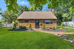 Welcome to this charming Cape in Farmingdale, showcasing beautiful cedar shingle siding, a brick walkway, and undeniable curb appeal. Step inside to a bright living room highlighted by a brick fireplace and vaulted ceiling, creating a warm and inviting atmosphere. The eat-in kitchen offers sliding doors leading to the deck, perfect for seamless indoor-outdoor dining. This home features three bedrooms, including a second-floor bedroom with a skylight, along with a fully updated bathroom. Andersen windows throughout provide comfort and efficiency, while natural light fills every room.Outdoors, enjoy a spacious deck for entertaining, an in-ground sprinkler system for easy maintenance, and a handy shed for additional storage. Notable mechanical updates include 200-amp service, an alarm system, a separate hot water heater, and efficient electric heating.Located in a desirable neighborhood near shopping, dining, parks, and public transportation, this home combines style, comfort, and convenience. Donâ€™t miss the opportunity to make this Farmingdale gem your own!