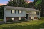 Welcome to this bright and airy 3-bedroom, 2-bathroom home nestled on a serene and quiet road, set on a beautifully landscaped 1.10-acre lot. Enjoy peaceful living with easy access to Pine Bush Village, offering charming shops, restaurants, and the desirable Pine Bush School District. Only 10 miles to the train and 80 miles to NYC â€“ a perfect blend of countryside charm and commuter convenience! Spacious kitchen features solid wood cabinetry, wall oven, cooktop, dishwasher, fridge, and pantry, complemented by new kitchen flooring and a butcher blook barstool seating area!  Formal dining area with sliders leading to a large deck overlooking the expansive yardâ€”perfect for BBQs, gatherings, and relaxing and enjoying nature. Bright and airy living room with gleaming wood floors. The fully finished lower level boasts a renovated family room with a charming brick fireplace and shiplap accent wall, a stylish mudroom, and a crisp, updated bathroom with white subway tiles.  Outside, you&rsquo;ll find an oversized driveway, two sheds, a fire pit area, and plenty of room to roam. Close to Pine Bush Village with quaint shops and restaurantsâ€”this home offers both functionality and charm in a quiet yet convenient location. Don&rsquo;t miss the opportunity to make it yours!