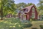 This 4-bedroom 2 bath main house, and 3-bedroom 1 bath cottage are located on 4.5 wooded acres with scenic views in the historic artistsâ€™ hamlet of Cragsmoor, located on a ridge in the Shawangunk Mountains. The community is encircled by 24, 000 acres of lands protected by the Minnewaska State Park Preserve with Sam&rsquo;s Point Preserve minutes from the property. The main house was built in 1907 by the architect Frederick Dellenbaugh for the artist Carroll Butler Brown and named the Falcon. Its living room is of chestnut post and beam construction with a chestnut staircase to the second floor, and a lovely working stone fireplace. Also on the first floor is a formal dining room, office area, kitchen, full bath and mudroom. The second floor has 4 bedrooms and a full bath. There are hardwood floors throughout.There is a basement with a laundry room and mechanical room that opens to a two-car garage. The cottage is equally full of charm fully renovated in 2021 with a working stone fireplace in the living room that flows into the kitchen with doors to a patio on one side and stone terrace on the other. Also on the first floor is a room suitable for a small bedroom or office. The second floor has a full bath, 2 bedrooms and a 3-season sleeping porch. In addition to wealth of nature, the property is centrally located for enjoyment of the cultural and culinary richness of the Hudson River Valley, while being an hour and forty-five minutes from New York City.