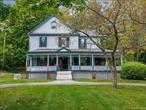 Charming 1900s Home with Character and Versatility! Step into timeless elegance with this beautifully preserved early 20th-century residence, ideally located just a few doors from the vibrant hamlet of Highland. Surrounded by quaint restaurants and shops, this home offers both historic charm and modern convenience. Exterior highlights include a wrap-around covered porch, a classic feature thatâ€™s perfect for morning coffee or evening relaxation. A circular driveway that adds a welcoming touch and easy access for guests. A lush setting that nestled in The Hamlet of Highland with tree-lined streets and a strong sense of community. The main level features original woodwork with rich details throughout, showcasing the craftsmanship of a bygone era. French doors, beautiful hardwood floors, a stone fireplace that anchors the living room with warmth and rustic charm. As well as a new kitchen that has been thoughtfully updated for modern living while respecting the home&rsquo;s heritage. Large enough for hosting dinner guests, or food prep. The formal dining room is spacious with lovely details. Thereâ€™s also a primary bedroom addition thatâ€™s spacious and private, offering comfort and convenience, with its own bath and separate entrance. Beautiful tin ceilings are hidden above the current drop ceiling in the living room, a perfect opportunity to restore vintage flair. The legal second level apartment has its own separate entrance thatâ€™s ideal for guests or extra rental income. The flexible layout can be tailored to suit a variety of needs from a studio, to an office, or a full apartment! Additional spaces include the full unfinished basement thatâ€™s a blank canvas for storage or hobbyists. A semi-finished attic on the third level which offers plenty of potential for creative use: think art studio, playroom, or cozy retreat. Modern updates include upgraded electric to ensure safety and support contemporary appliances and tech. Each level has a washer and dryer. This home is a rare blend of historic charm and modern potential, perfect for those who appreciate character and crave flexibility. The backyard is spacious with a country feel. All this is just a short distance from the hamlet where you can grab a coffee, a slice of pizza, or enjoy a sit down dinner. Quaint wine bar, antique shop and small shops are also open for enjoyment. Outside the village is the popular Walkway over The Hudson, The Mid-Hudson Bridge will bring you right to Metro North Rail Station for easy commuting. Just two-miles from area hospitals. Enjoy all the Hudson Valley has to offer!