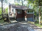 Nature Lovers Paradise! 2 Bedroom, 1 Bath Cottage, 550 Sq. Ft. Good Condition, Recently Painted, Two Living Room Skylights. Washer-Dryer in Unit. ONLY $225000. Near the top of Schunnemunk Mt., Nice Views. Very Private Area. Great Hiking Area, thousands of acres of NY State, preserved land at this location. Baseboard, Gas Heat system and wood stove to heat home. Large Deck. One Lot, SBL 37-2-2.21, Approximately 60 x 186, (from plot plan.) Oakwood is a Private Trail. Seller will consider OWNER FINANCING with 50% down. Please do not go unaccompanied, appointment required. Rented Propane Tanks Excluded