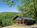 Discover your own slice of mountain paradise where adventure literally begins at your doorstep. Set at the end of the rural, aptly named Trails End Road, this stunning modern cabin sits at the gateway to 19, 000 acres of Sundown Forest, a wilderness with a system of hiking trails that starts just steps away. Completely renovated, rebuilt from the studs inside and out, this modern just-right cottage perfectly marries contemporary comfort with the raw beauty of the surrounding forest. Whether you&rsquo;re seeking morning meditation by the water or afternoon adventures, this natural sanctuary offers endless possibilities for connection with nature. Pull into your private drive to be greeted by close-up views of a majestic mountain that feels like a protective friend. Follow the magical woodland path that winds through the 2-acre property to frontage on pristine Sapbush Creek or spend time relaxing to bird-song on the front porch. The heart of this mountain home is the state-of-the-art kitchen, designed to take advantage of the inspiring mountain vista that transforms everyday cooking into a communion with nature. The open living space feels like an art gallery nestled in the forest, featuring soaring vaulted ceilings, recessed lighting, and spectacular picture windows showcasing original historic bubble glassâ€”a charming nod to the property&rsquo;s heritage. Every detail has been thoughtfully updated for contemporary comfort, including a bath with premium finishes, convenient laundry room with washer and dryer, many new energy-efficient windows, and two comfortable bedrooms. While you&rsquo;ll feel miles from everything here, popular Kerhonkson and Kingston spots like Inness, Rough Cut Brewery, and Westwind Orchard are minutes away. Whether you&rsquo;re an avid outdoorsperson, nature photographer, or simply seeking a peaceful place to call home, this mountain sanctuary provides the perfect basecamp for your adventures. Experience the magic where trails end and your new beginning starts.