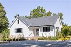 Move right in and start your North Fork dream todayâ€”this home is truly turn-key.Impeccably renovated and expanded in 2022 by a highly regarded architect in collaboration with Gabrielsen Builders, this contemporary Jamesport retreat offers effortless living in the heart of the North Fork. Set back over 130 feet on a lush, tree-filled .70-acre lot, the home combines modern comfort, thoughtful design, and immediate access to some of the areaâ€™s most beloved amenities.Inside, 1, 330 square feet of light-filled living space features a vaulted ceiling, white-oak hardwood floors, and double-paned Andersen windows. The chefâ€™s kitchen is equipped with top-of-the-line appliances, including an LG Signature stove with double ovens, a Samsung French-door refrigerator, a Sharp Insight Pro microwave drawer, and a Bosch dishwasher. The renovated full bath features large-format tile and an Ove smart bidet toilet. A new roof,  Navien on-demand hot water system, Rheem gas central heating/cooling, and a new septic system (serviced in 2025) ensure years of worry-free ownership.Additional conveniences include a full 764-square-foot basement with a Maytag refrigerator/freezer, a one-car garage with 220-volt capacity for EV charging (or potential studio use), and a new outdoor storage shed.Two distinct outdoor entertaining areas invite gatherings in every season: a private side patio perfect for dining, grilling, and lounging, and a circular front gravel lounge with firepit â€“ all framed by old-growth trees and lush new landscaping.The home is just a three-minute walk to Jamesport Vineyards, Harbes Farm Stand, Little Oak Wood Fired Kitchen, Main & Mill House, the Jamesport Country Store, and William Ris Gallery. Also a minute away by car are Jamesportâ€™s restaurants, cafes, shops, and amenities including the Main Road Biscuit Company, Grana Trattoria Antica & Enoteca, Jedediah Hawkins Inn, Cliffâ€™s Elbow Room, Black Sheep Bagels, Kam Hung Kitchen, Lennyâ€™s Pizza & Bistro, Dunkin Donuts, the post office, Barths Pharmacy and the gas station. South Jamesport Park & Beach on the Peconic Bay is a 5-minute drive, and Iron Pier Beach on the Long Island Sound is only 7 minutes away.Home is in the Rural Corridor (RLC) Zoning Use District.