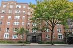 Move Right Into This Spacious 1 Bedroom Co-op In Jackson Heights Featuring Modern Kitchen, Updated Bath, Parquet Hardwood Floors Throughout And High Ceilings. Arlington Hall Was Built In 1939 And Features Private Gardens For Shareholders To Enjoy, Live In Super And Storage. Easy Access To Shopping And Transportation - 20 Minute Commute To Manhattan.