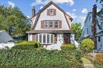 The Charm You Love, in the Location You Need - Begin your next chapter in this warm and inviting Colonial, ideally located in the heart of the Inc Village of Malverne. Step inside the spacious entry foyer and find a traditional floor plan filled with natural light and timeless character. Fresh hardwood floors flow throughout a generous living room with a natural gas fireplace, formal dining room with access to covered patio, and a bright sitting room featuring a charming bow window, creating the ideal space for gatherings. The kitchen is equipped with natural gas range, solid cabinetry, and plenty of potential for updating to your own taste. The second floor boasts three well-sized bedrooms with ample closets providing comfort and practicality. Plus pulldown stairs to a full attic with flooring and high ceiling offering excellent storage. The clean, full basement includes laundry, a young boiler (2016), and room for storage or future recreation. Outside, enjoy a private backyard with a covered patio, and a detached garage with long private driveway offering plenty of off-street parking. Conveniently located near schools, shops, parks, and transportation. With the combination of classic design and solid bones, this home is ready to be personalized to fit your lifestyle. Make time to see it this week! -- Private viewings now. (total taxes of $14, 160 include village taxes, and do not include Star rebate)