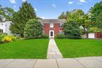 Nestled on one of the most sought-after streets in the Village of Croton, this stately 1932 brick Colonial effortlessly blends timeless elegance with curated modern sophistication. A rare offering, this residence invites you to experience refined living just moments from the Hudson River. Gracefully set back on a quiet cul-de-sac, this distinguished home welcomes you with architectural charm and mature, manicured grounds. Inside, the formal living room sets the toneâ€”anchored by a wood-burning fireplace and a wall of custom built-ins, itâ€™s the perfect sanctuary for intimate gatherings or quiet reflection. The intimate dining room leads to a versatile first-floor guest suite or home office, complete with a sleek en-suite bath and walk-in closet. A few steps down reveal an expansive family/media room with exposed brick walls and direct access to the private backyard oasis. At the heart of the home lies a thoughtfully updated eat-in kitchen, flowing into a cozy den with sliding glass doors that open onto a slate patioâ€”ideal for alfresco entertaining. Upstairs, the romantic primary suite features its own fireplace, walk-in closet, and a freshly updated bathroom with dual access. Additional bedrooms offer exceptional privacy and space, thoughtfully arranged with a central alcoveâ€”ideal as a study or reading nook. Landscaped walkways to the detached two-car garage and separate studio space, perfect for creatives or remote work. Located just half a block from picturesque Sunset Park and within walking distance to village amenities including schools, library, shops, dining, Silver Lake, and the Metro-North station, this home offers a seamless blend of tranquility and convenience. The express train delivers you to NYC in under an hour. A legacy property in a premier locationâ€”experience the lifestyle that awaits at 18 Observatory Drive. Some photos virtually staged.
