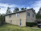 3 Bedroom 2 Bath with Legal Accessory Apartment. Main home. Living Room with Wood Burning Stove, Kitchen with Dining Area, 2 Bedrooms, Full Bathroom & Laundry Rm. Lower level Daylight Apartment: Den, Kitchen, 1 Bedroom, Full Bathroom. Part unfinished basement with utilities and ose