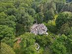 Set back from the road in one of Bedfordâ€™s loveliest estate areas, down a tree-lined drive, sits 328 McLain Street. Designed and built in 1906 by the distinguished firm of Delano & Aldrich as the country retreat of Judge Learned Hand, this gracious Colonial residence is nestled on 16+ acres, with specimen trees, sweeping lawns, and perennial gardens that create a setting of rare serenity. The unmatched privacy and acreage within minutes of trains/schools/shops all just an hour from the city are perfect as a full-time or country house. Its timeless style makes it as appealing now as when it was first built.The house offers all the hallmarks of Bedford country living: swimming pool and chic cabana, charming guest cottage (think Brooklyn meets Paris), greenhouse, caretakerâ€™s cottage, detached garage, and a maintenance barn.Inside, the airy sunlit living room and the ample dining room, both with fireplaces, have French doors that open to an open plan sun-filled solarium, creating an easy flow. Outside the sunroom, a bluestone terrace overlooks an English garden that frames the additional acreage beyond. The chefâ€™s kitchen and adjoining sitting room provide a warm, informal gathering space.Upstairs, the primary suite offers a spacious, tranquil retreat, complete with a fireplace and an ensuite bath. Former sleeping porches have been reimagined as a playroom and guest quarters, while additional bedrooms, each with their own distinctive fireplace, enjoy garden views through large casement windows. The third floor adds further versatility with two generous bedrooms, a classic bath, and a sun-filled skylit artistâ€™s studio with adjoining atelier.This rare gem truly combines architectural pedigree, gracious proportions, and enduring charm.