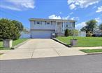 Beautiful Hi-Ranch located in Bay Shore 3 bds and full bath on upper level. Fully renovated Kitchen with Formal dining , Spacious Living room , Natural Gas , Stainless Steel Appliances, Corner Property .Lower level has large bedroom with WIC, Den with fireplace and a little bar area, Full bath and also a 1/2 bath .Vinyl Fenced yard.
