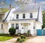 Welcome to this sun-lit beautiful Colonial home in the highly sought-after neighborhood of Jamaica Estates. This beautifully updated residence offers 4 spacious bedrooms, 2.5 baths, and a walk-up finished attic with a large fourth bedroom â€“ perfect for guests, a home office, or additional living space. The home features gleaming cherry wood floors throughout, sun-drenched living room, high ceilings, a spacious formal dining room, and a modern updated kitchen complete with sleek stainless-steel appliances.The basement is fully finished with a separate entrance. Enjoy a cozy family room, full bath, and laundry area. Step outside to enjoy a private backyard, perfect for relaxing, entertaining, or gardening.Additional perks include a brand-new roof, new gutters, gas heat, 5 split dual units, a detached 1-car garage, private driveway and zoned R3-X!