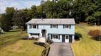 This gorgeous, fully renovated split level ranch is in the Southgate community within the Spackenkill School District. Beautiful hard woods floors throughout and an abundance of windows let in wonderful sunlight. The renovated kitchen has new soft close cabinetry, stone counter tops, recessed lighting and brand-new appliances. Off the kitchen is a fantastic three-season porch with new floors with views of the expansive fenced in backyard and shed. The open concept space is ideal for entertaining family and friends. On this level there are three bedrooms and one full bath which has also been renovated. The lower level would make an ideal family room or in-law suite as it has a separate entrance with an updated half-bathroom. There are three additional rooms perfect for a home office or two, storage or study. The laundry area completes the lower level. Numerous upgrades have been made: Navien tankless gas heating system, landscaping, new kitchen and bathroom to name a few. The driveway is large and can accommodate three cars. Taxes are $10, 040. Minutes to shopping, restaurants. Close to the train and Amtrak.
