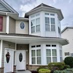 Experience effortless, single-floor living in this thoughtfully finished first-floor, end unit located in the sought-after 55+ community of Stoneleigh Woods. This spacious two-bedroom, two-bath home features an open-concept layout with high ceilings, wood flooring, and modern stainless steel appliances. The kitchen features a center island that seamlessly flows into the living room and a versatile dining/alcove area. The primary suite offers a private retreat with an en-suite bathroom and a generous walk-in closet. The secondary bedroom opens to the quaint back patio. Additional highlights include a brand-new, ventless water heater installed in 2024. Residents of Stoneleigh Woods enjoy access to walking trails, a clubhouse with a fitness center, boardroom and a beautifully furnished outdoor patio.Conveniently located near restaurants, shopping centers and hospitals, this residence is a must see!