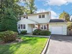 Nestled on a quiet cul-de-sac, this 3-bedroom, 1.5-bath Colonial combines charm, space, convenience and opportunity. Inside, youâ€™ll find a spacious primary bedroom with generous closet space, a traditional eat-in kitchen, open living, dining and den areas with potential for a more modern flow. The partially finished basement adds versatility with plenty of storage and room to reimagine, while the oversized 1.5-car garage provides additional functionality. Step outside to a cozy back patio and enjoy your morning coffee. With easy access to the train, main roadways, shops & schools, this home is ready for its next chapter.