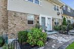 Welcome to this pristine 2 bedroom ground level end unit with terrace in the heart of desirable Top of Harbor! Enjoy winter water views in this private & incredibly maintained community. Some of the upgrades include, wood flooring, marble counters, crown moldings, tilt in windows, light and bright hi hat lighting throughout. Maintenance includes: heating, water, all outside maintenance and ground care, parking, snow and garbage removal.