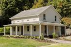 A darling c1838 antique farmhouse on a lovely acre of land, complete with an incredible studio/gallery space with fantastic natural light and soaring ceilings. Gorgeous hydrangeas line the front porch, and you&rsquo;ll find pear and quince trees on the property. The home has been beautifully renovated with Marmorino plaster wallsâ€” an incredibly nuanced and high-end finish that is rare in a house at this price point. Youâ€™ll find gorgeous white oak floors throughout and exposed beams in the ceiling. The kitchen is open and light filled with warm grey cabinetry and brand new appliances, and the farmhouse sink is right at home. Carrara marble countertops elevate the space. The wood stove anchors the light filled living room, with a zellige tile accent that is mimicked in the powder room. Upstairs there are three bedrooms and a wonderfully spacious & luxurious full bath. There is a large, curbless shower & a cast iron soaking tub. Outside, the large detached studio is tucked into the landscape. Its cathedral ceilings make this the perfect space for a studio, gallery or workshopâ€” the possibilities here are endless. 444 Fish Creek is just minutes to the wonderful walking trails at Opus 40 and ideally situated to enjoy all that the Hudson Valley has to offer. Just 2h north of NYC.