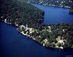 BOAT! SWIM! FISH! TENNIS! GOLF! Introducing an AMAZING LAKEFRONT ESTATE with 200 feet of prime waterfront on magnificent LAKE MAHOPAC. Enjoy your own boathouse with entertainment deck, a sparkling inground pool with pergola & BBQ, and the most breathtaking views of one of the most beautiful lakes in the world, known for its crystal-clear waters and scenic vistas. This architecturally stunning home showcases inlaid wood floors, custom moldings, and a dramatic wall of 14 lake-facing windows that flood the interior with natural light and serenity. Highlights include a Chefâ€™s kitchen with Viking stove, Sub-Zero refrigerator, center island, and spacious pantry, Living room with panoramic lake views, Office with stone fireplace, Formal dining room with stone fireplace, Den & impressive entrance foyer. The primary suite is truly a retreat, boasting a 21â€™ x 30â€™ grand bedroom, four closets, a luxurious spa bath with Jacuzzi and glass-enclosed shower, a dramatic spiral staircase to the â€œWidowâ€™s Walkâ€, and a private balcony with awe-inspiring views of the lake. With an additional 3 bedrooms and 3.5 baths, this home is perfect for hosting family and friends in comfort. All of this just 50 miles from NYC, easily accessible via the Taconic Parkway, Route 684, and Metro-North. Residents of Lake Mahopac enjoy year-round activities: boating, swimming, fishing, two local golf courses, multiple tennis/pickleball courts, a 50-mile bike path, and fine dining with three restaurants directly on the lake. Just listed! Donâ€™t miss this rare lakefront opportunity!