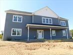 This 2573 sq.ft. Colonial Bilevel with 4 bedrooms and 3 full baths is the last home left. Vaulted high ceilings with open floor plan. Plan includes kitchen with 6&rsquo; island with quartz countertop, sliders lead to a 14 x 14 Fiberon maintenance free deck off the dining room/kitchen area. Kitchen appliances are included. Primary bedroom with walk in closet and gorgeous bathroom with double vanity and fully tiled shower. First floor features a fireplace in the large family room, bedroom, full bath, laundry room and 2 car garage. There are hardwood floors throughout the home, tile in all bathrooms and laundry. Property is just over 2 acres with Wallkill Schools!