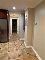 Move right into this 2 bedroom, 1 bath up-daated apartment. Located on the second floor.  Features Kitchen with island and granite countertops. Living room, plus 2 bedrooms. There is a common laundry area in the basement. Close to all including shopping & LIRR.