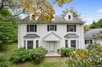 Move right in to this stunningly updated young (1998) Colonial nestled on one of the most picturesque streets in Hartsdale&rsquo;s Manor Woods - easy walk to train! The beautiful home with steel framing is flooded with light, high ceilings and over sized rooms gracefully laid out with a modern aesthetic. The inviting living room with a cozy fireplace is an open floor plan seamlessly flowing into an adjoining large dining room. Across the hall the family room has a working fireplace and sliding doors to a private deck, inviting you to enjoy tranquil moments outdoors. A gracious center hall leads to an impressive modern kitchen with a windowed bright dining area. With endless cabinet space and expansive countertops, this kitchen would make a gourmet cook delighted. Off of the kitchen is a storage area with washer/dryer that adjoins a two car garage. All three floors were painted this summer as well. The lower level is 1000 square feet (not included in the square footage), finished with large windows, a legal full bathroom and a door to walk out to the backyard - this area is perfect for hosting, as an entertainment area, a home gym, or even accommodating an au pair. Some rooms in the photo roll have been digitally staged to inspire your vision, but the true magic happens when you walk through this delightful home. Envision the countless possibilities it offers to make it exclusively yours! Embrace the lifestyle you&rsquo;ve always dreamed of in this lovely Manor Woods gem!