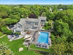 A breathtaking waterfront estate on Long Island Sound is being offered for the first time by its original owners. The coastal beauty of the North Fork stands out as one of the most sought-after and picturesque areas on the East End! Nestled on nearly 2 acres, this 4, 500 sq. ft. residence showcases exceptional views and over 200 feet of private waterfront. The spacious open floor plan features a junior primary ensuite on the first floor, complete with a separate private entrance and direct access to the backyard. The gourmet kitchen inspires culinary creativity with custom cabinetry, high-end appliances, and ample space for entertaining. Experience the joy of al fresco dining along the breezeway that leads to the inviting patio. The living room and dining room, enhanced by a central fireplace, bask in natural light. Upstairs, the primary bedroom offers a tranquil retreat, complete with a balcony and an ensuite bathroom that reveals breathtaking views. An oversized lounge, also with a balcony, effortlessly connects to the kitchen below via a private staircase, creating an ideal space for entertaining guests above. Additional bedrooms, a bathroom, and a bonus space with a terrace provide privacy and comfort for visitors. The large art studio upstairs, overlooks the outdoor custom kitchen, and dining area, stunning pool, spa, and shower inviting inspiration. The yardâ€™s mature landscaping and expansive lawn create a welcoming atmosphere for unforgettable waterfront gatherings.