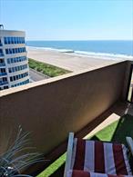 Enjoy breathtaking ocean views from this spacious 1-bedroom, 2-bath apartment, featuring a large living room, private bedroom, and a terrace perfect for relaxing by the sea. The kitchen includes a new stove and dishwasher, and the unit offers a walk-in closet, abundant storage, and a new in-unit washer and dryer. A secure garage provides space for your car and bicycle. Step outside to direct boardwalk access and take advantage of two oceanfront pools, a jacuzzi, and 24/7 concierge and doorman service. Tenant responsible for electric and internet. No petsWinter Rental: October 15 â€“ May 15Experience luxury living right on the water this off-season!