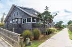 A classic Fire Island gem! This original beauty offers four spacious bedrooms and one and a half baths, with generously sized rooms throughout. Step inside to a bright and airy living room featuring a cozy fireplace and a wall of windows with built-in seating, seamlessly flowing to the welcoming front porchâ€”perfect for relaxed coastal living. The kitchen offers island seating and connects to a large dining room, ideal for entertaining, which opens to a charming enclosed back porch and out to the deck with an outdoor shower. Perfectly situated close to town, youâ€™ll enjoy easy access to shops, dining, and the beachâ€”an ideal blend of timeless charm and convenience. The house has been raised to FEMA regulations.