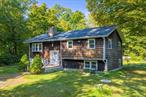 Welcome to this renovated 1, 620 SF raised ranch in Pawling Lake Estates, a charming lake community nestled atop West Mountain and adjacent to West Mountain State Park. Steps in reveal freshly painted walls and refinished hardwood flooring throughout the 1, 120 SF first floor. The living room has a massive stone fireplace and wood-burning stove insert, which opens to the dining area. A renovated kitchen boasts custom cabinetry, updated appliances, and a door to the screened porch. The porch adds 250 SF of space to dine al fresco, sit back and relax, or entertain. Three bright bedrooms and a full bath with updated fixtures complete the first floor. The lower level has 500 SF finished, a pellet stove, a door to the backyard, and additional unfinished space waiting to be finished. Outdoors, there is great yard space all around. The backyard is cleared, level and park-like. Out front is a semi-circle driveway with garden space in the center and plenty of parking.Living in Pawling Lake Estates, you will spend summers at the lake enjoying all that it has to offer, a community house, recreation area, playground, picnic benches, sandy beach, and docks. Swim, fish, paddleboard, kayak in this private non-motorboat lake. Community events year round add to the charm and the nostalgic feel of the area. Yet just minutes away, the Village of Pawling offers boutique shops, fun eateries, fine dining, the Pawling Metro North Train Station, trails, town parks, and a seasonal farmerâ€™s market.